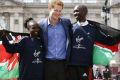 Prince Harry with Mary Keitany & Wilson Kipsang / Photo: Reuters