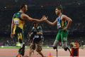 Alan Fonteles Cardoso Oliveira of Brazil is congratulated by Oscar Pistorius of South Africa after winning gold in the Men's 200m - T44 on Day 4 / Photo: LOCOG