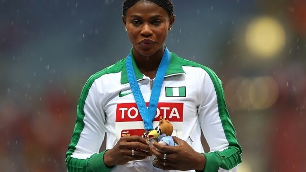 Silver medalist Blessing Okagbare of Nigeria on the podium during the medal ceremony for the Women's Long Jump final during Day Two of the 14th IAAF World Athletics Championships Moscow 2013 at Luzhniki Stadium on August 11, 2013 in Moscow, Russia. (Photo by Mark Kolbe/Getty Images)