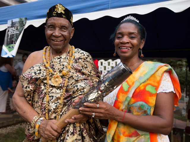 Ezekiel Cofie (93 years old), also known as Nii Kojo Ababio V, holds the Queen's Baton with his daughter Zetta   Cofie, in Accra, Ghana, on Sunday 5 January 2014 / Glasgow 2014 OC Flickr