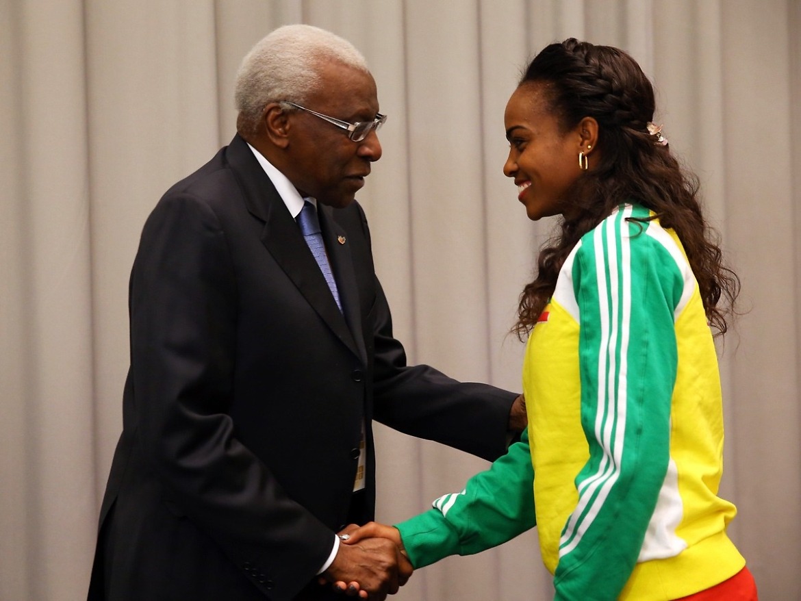 Lamine Diack (L), IAAF President greets Genzebe Dibaba of Ethiopia during a press conference prior to the IAAF World Indoor | Photo Credit: IAAF / Getty Images