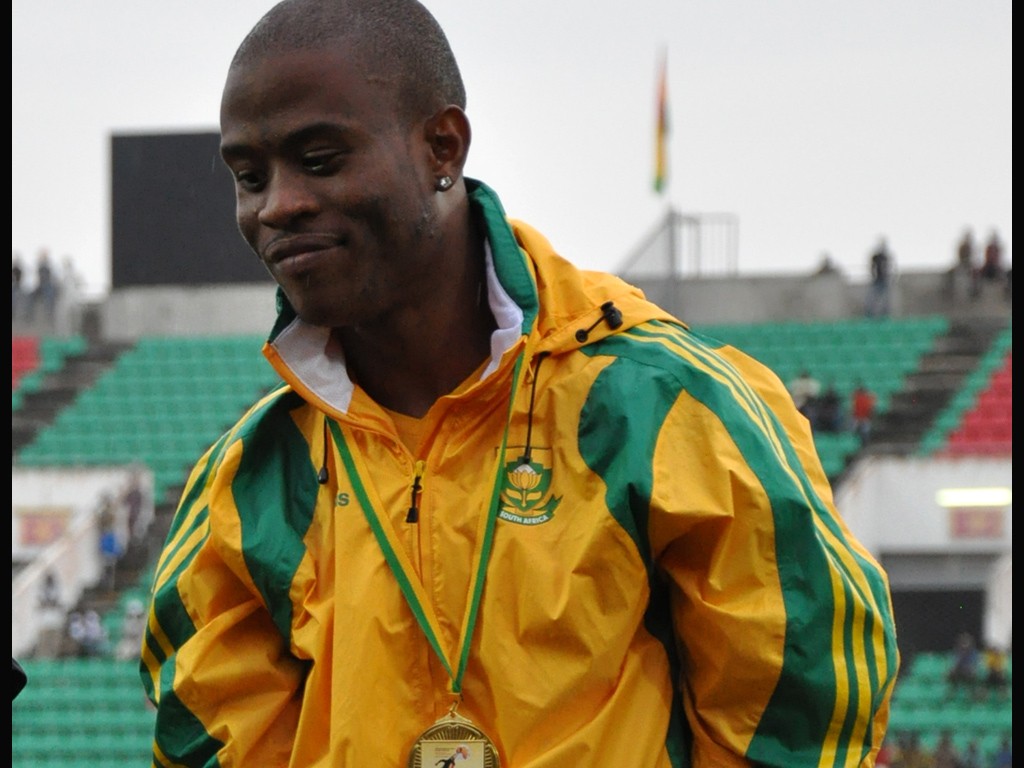 Simon Magakwe receiving his Gold medal after winning the men's 100m at the African Senior Championships 2012 in Benin / Photo credit: Yomi Omogbeja