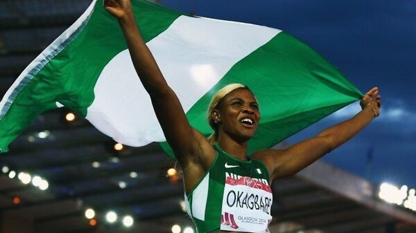 Nigeria’s Blessing Okagbare celebrates after winning the women's 100m and clocking a 10.85 Games record.
