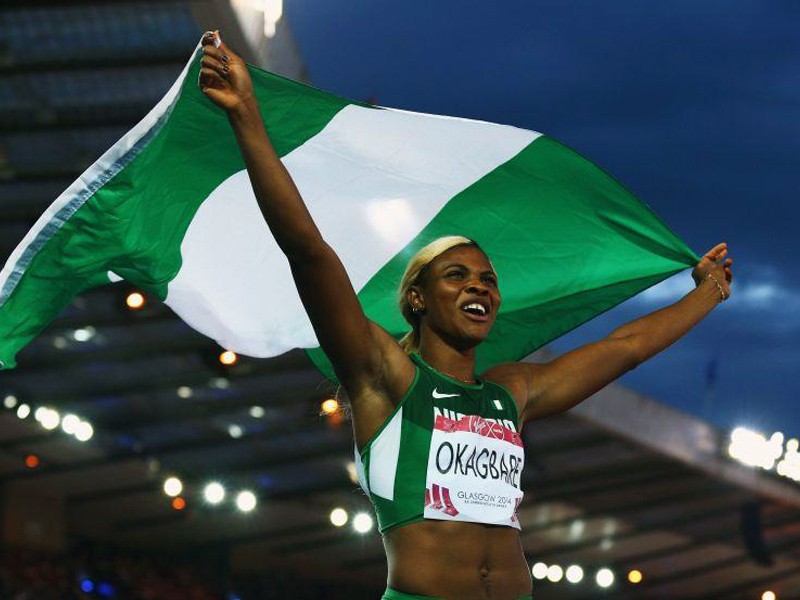 Nigeria’s Blessing Okagbare celebrates after winning the women's 100m and clocking a 10.85 Games record.