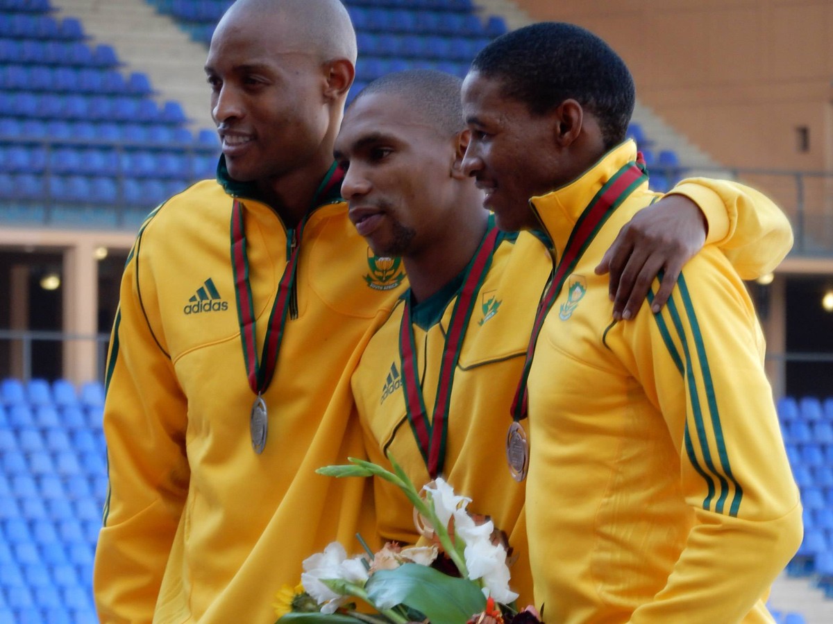 South African long jumper Zarck Visser, flanked by compatriots Khotso Mokoena and Rushwal Samaai, after winning the gold medal at the African Senior Athletics Championships in Marrakech, August 2014. / Photo credit: Yomi Omogbeja