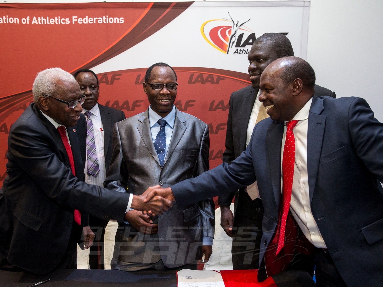 IAAF President, Lamine Diack congratulates the Ugandan delegation led by Hon. Charles Bakkabulindi, Honorary State Minister of Education and Sport / Photo credit: IAAF / Philippe Fitte