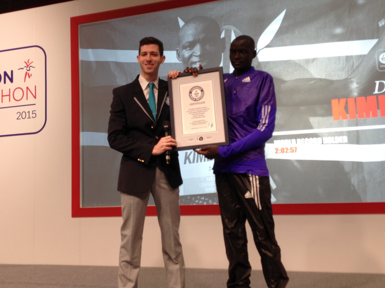Dennis Kimetto presented with the official Guinness World Records certificate in London on Friday April 24, 2015 / Photo Credit: Yomi Omogbeja - AthleticsAfrica.Com