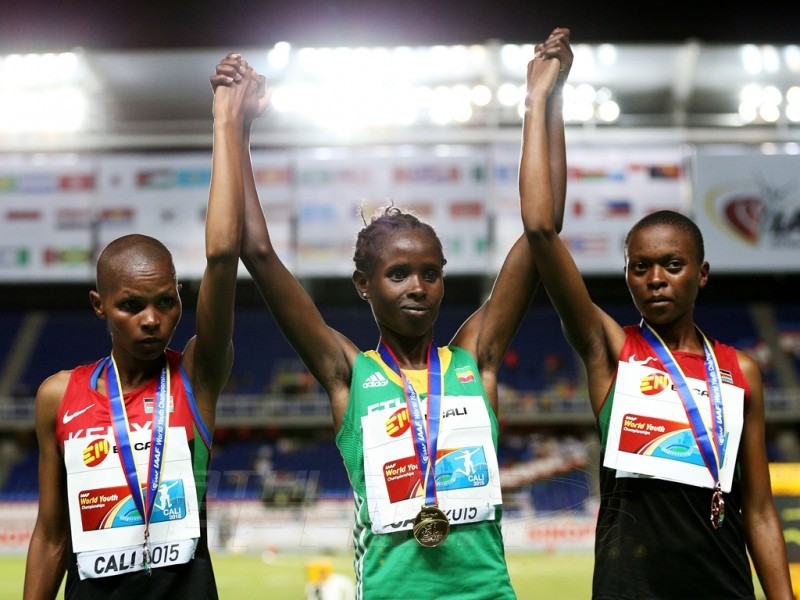 Shuru Bulo of Ethiopia, gold medal, Emily Chebet Kipchumba of Kenya, silver medal, and Sheila Chelangat of Kenya, broze medal, celebrate on the podium after the Girls 3000 Meters Final on day one of the IAAF World Youth Championships, Cali 2015 on July 15, 2015 at the Pascual Guerrero Olympic Stadium in Cali, Colombia. (Photo by Patrick Smith/Getty Images for IAAF)