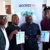 Olamide and Seye Ogunlewe with their race forms pose with head of the organising committee for the Access Bank Lagos City Marathon, Deji Tinubu / Photo: Lagos City Marathon