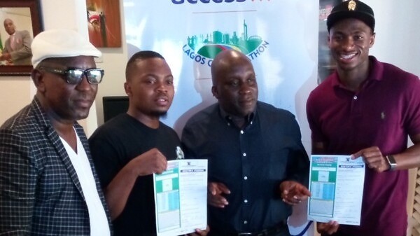 Olamide and Seye Ogunlewe with their race forms pose with head of the organising committee for the Access Bank Lagos City Marathon, Deji Tinubu / Photo: Lagos City Marathon