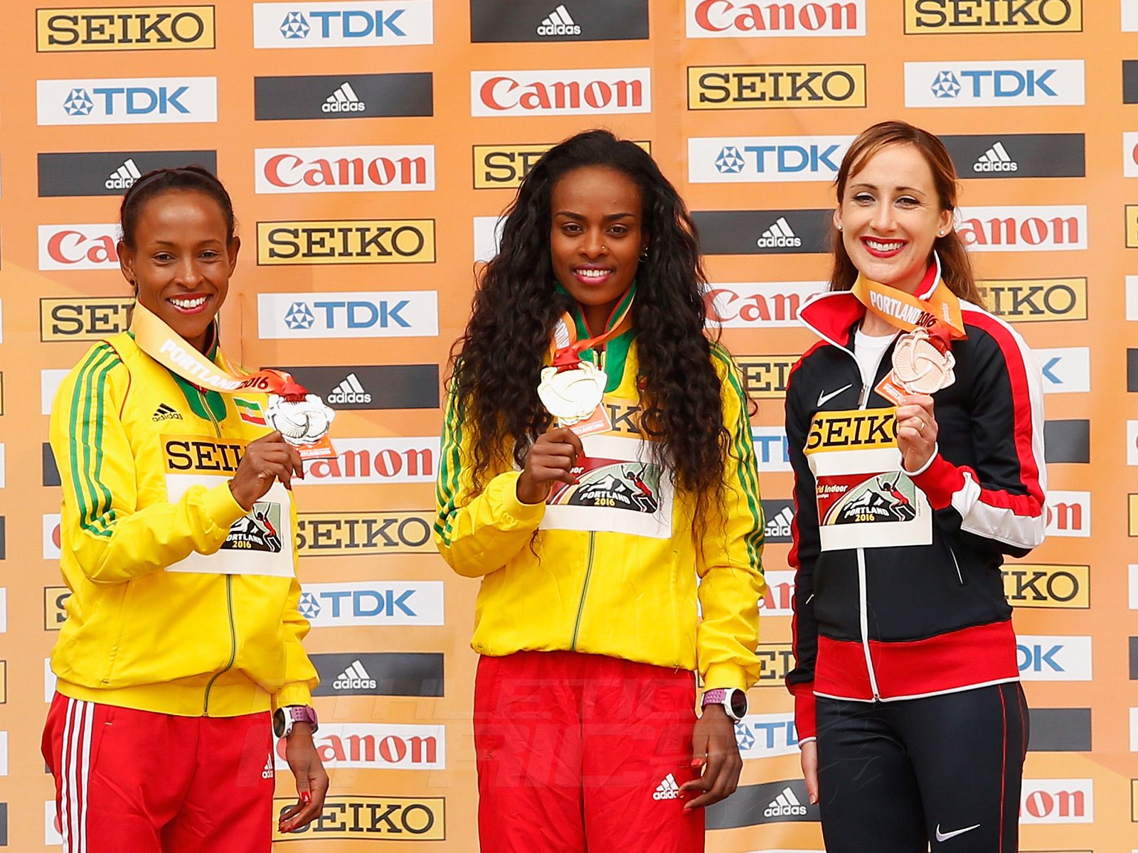 (L-R) Silver medallist Meseret Defar of Ethiopia, gold medallist Genzebe Dibaba of Ethiopia and bronze medallist Shannon Rowbury of the United States during the medal ceremony for the Women's 3000 Metres during day four of the IAAF World Indoor Championships at Pioneer Courthouse Squareon March 20, 2016 in Portland, Oregon. (Photo by Christian Petersen/Getty Images for IAAF)