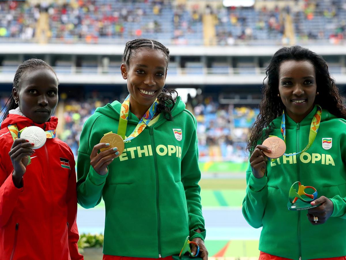 Ethiopia's Almaz Ayana with fellow women's 10000m medallists Vivian Cheruiyot and Tirunesh Dibaba on Day 1 of Athletics competition at Rio 2016 / Photo credit: Getty Images