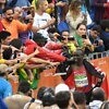 Kenya's Eliud Kipchoge with fans after he won the men's marathon gold on the final day of competition at the Rio 2016 Olympics in 2:08:44 / Photo Credit: Norman Katende
