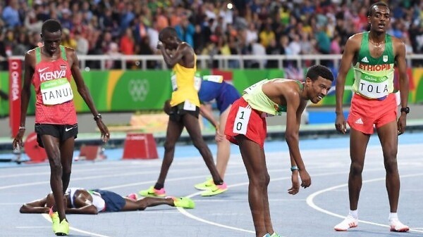 Paul Kipngetich Tanui of Kenya and Ethiopian Demelash after the men's 10,000 Final on day 2 at the Rio 2016 Olympics / Photo credit: Norman Katende