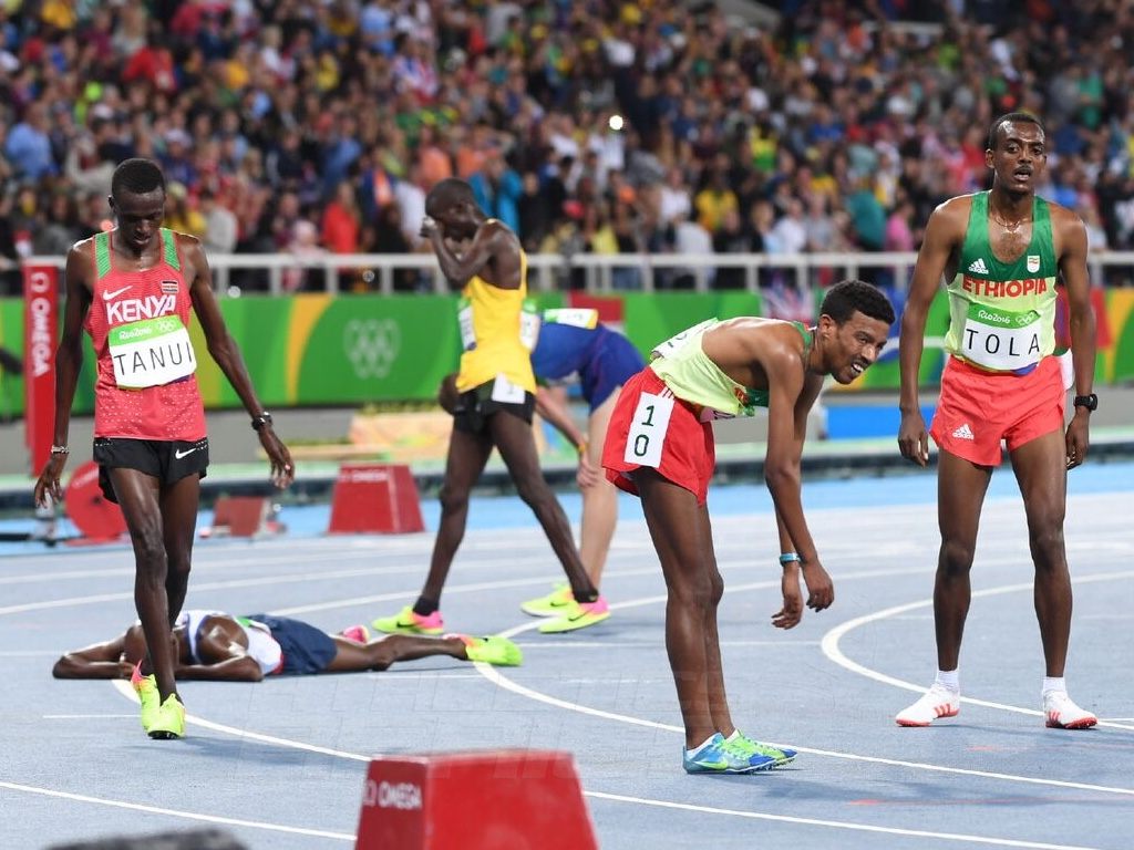 Paul Kipngetich Tanui of Kenya and Ethiopian Demelash after the men's 10,000 Final on day 2 at the Rio 2016 Olympics / Photo credit: Norman Katende