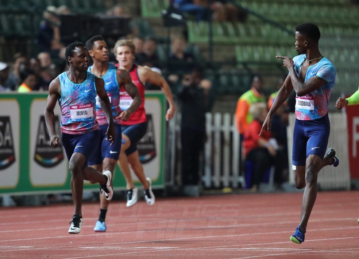 Anaso Jobodwana taunts Clarence Munyai as they cross the 200m men’s finish in 1st and 2nd place respectively. Photo Credit: Roger Sedres