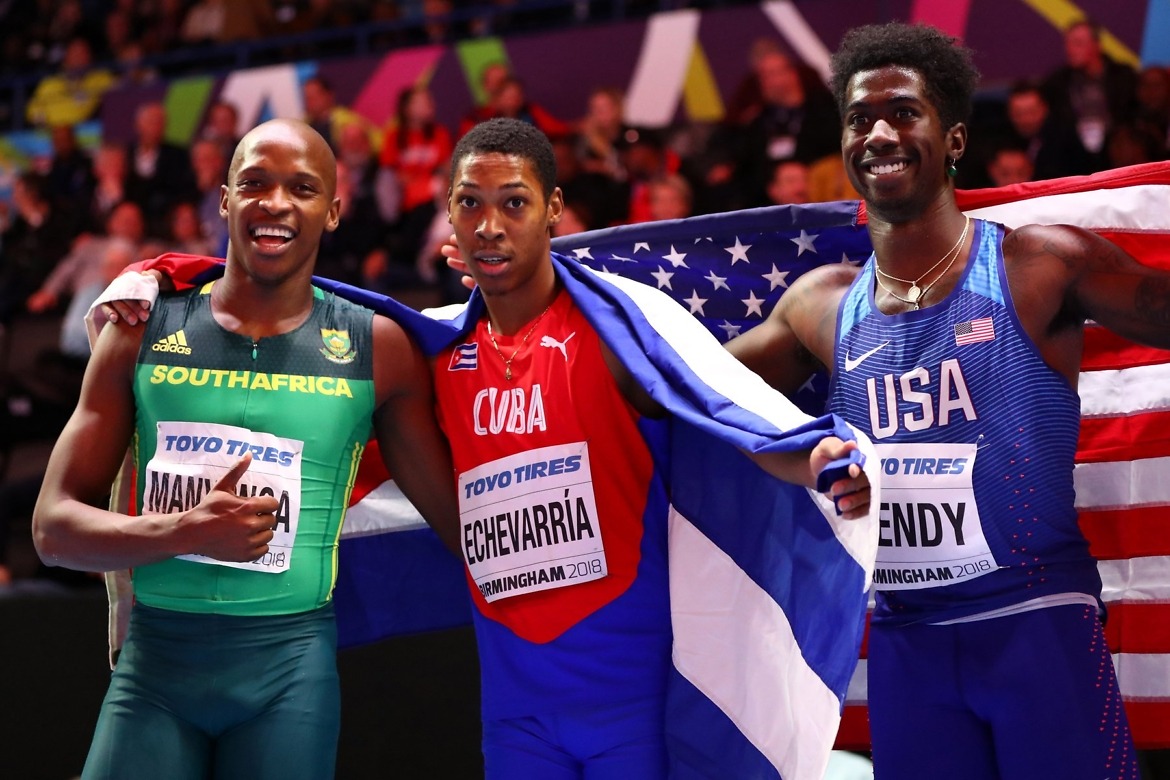Juan Miguel Echevarria (C) of Cuba celebrates winning the Long Jump Mens Final with Luvo Manyonga (L) and Marquis Dendy (R) of United States during the IAAF World Indoor Championships on Day Two at Arena Birmingham on March 2, 2018 in Birmingham, England. credit: Photo by Michael Steele/Getty Images for IAAF