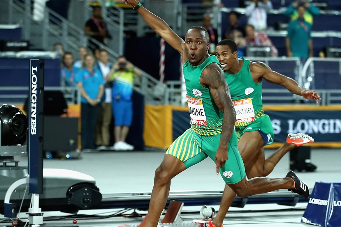 Akani Simbine of South Africa celebrates winning gold as he crosses the line ahead of-silver-medalist Henricho Bruintjies of South Africa at the Gold Coast 2018 Commonwealth Games / Photo credit: Getty Images