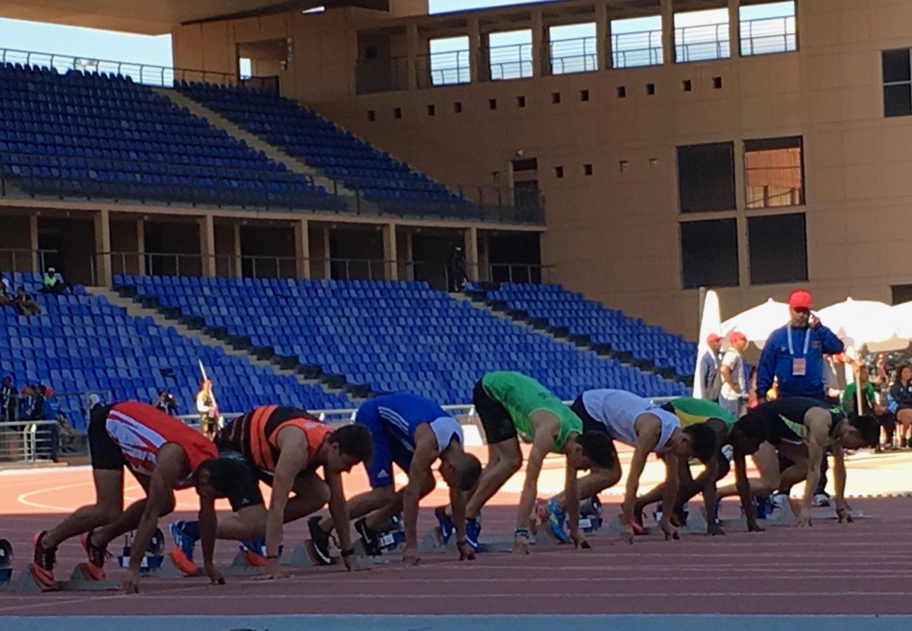 Athletes get set for the start of the Boys 100m preliminaries at the Gymnasiade 2018 in Marrakech / Photo Credit: Yomi Omogbeja