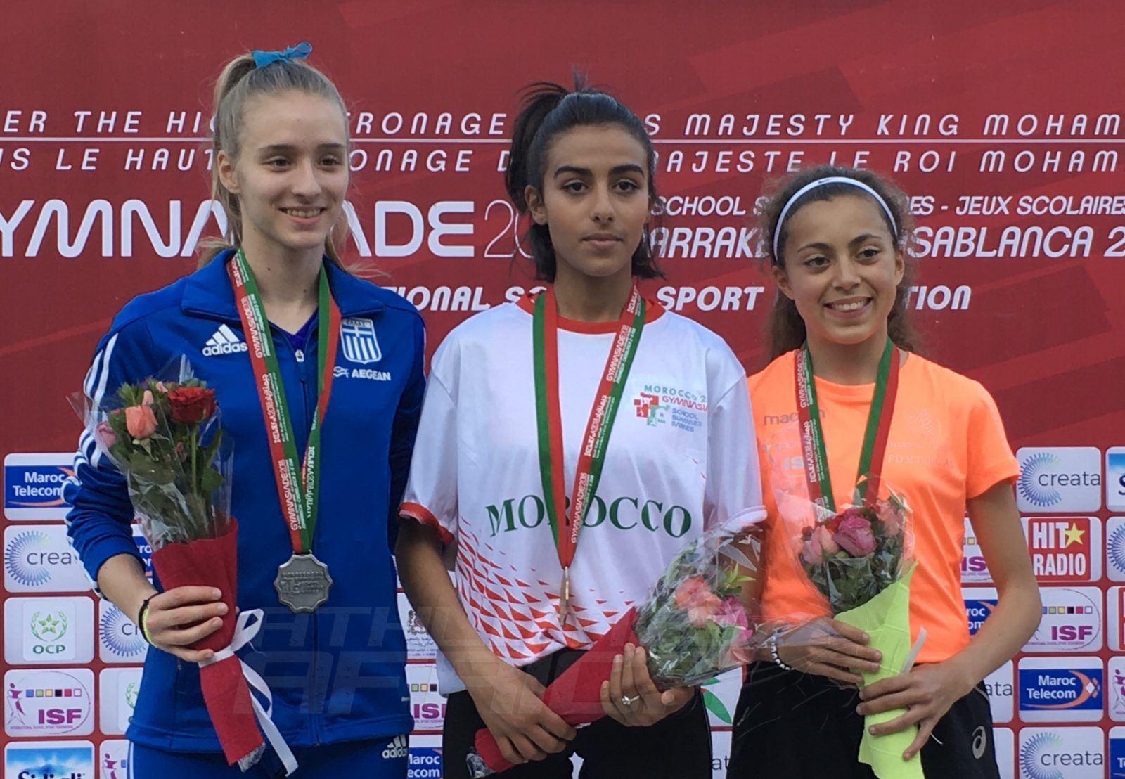 Morocco's Yassmine Bidkane (Centre) flanked by silver medallist Konstantina Chantzou (Greece) and bronze medallist Ines Borba (Portugal) during the medal presentation of Girls 1500m Final at the Gymnasiade 2018 in Marrakech / Photo Credit: Yomi Omogbeja