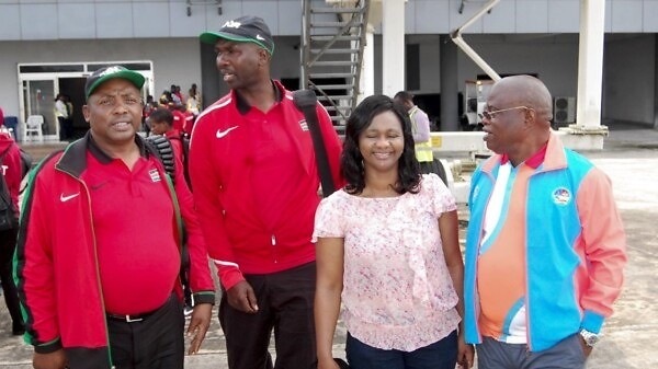 The Chair of the Asaba 2018 LOC, Chief Solomon Ogba, chats with officials of Athletics Kenya during the Kenyan team arrival at the Asaba International Airport for the 2018 African Senior Championships - 31 July, 2018. / Photo: LOC