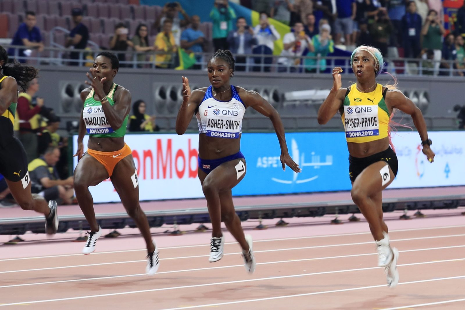 Dina Asher-Smith of Great Britain and Shelly-Ann Fraser-Pryce of Jamaica compete in the Women's 100 Metres final during day three of 17th IAAF World Athletics Championships Doha 2019 at Khalifa International Stadium on September 29, 2019 in Doha, Qatar. (Photo by Andy Lyons/Getty Images for IAAF)