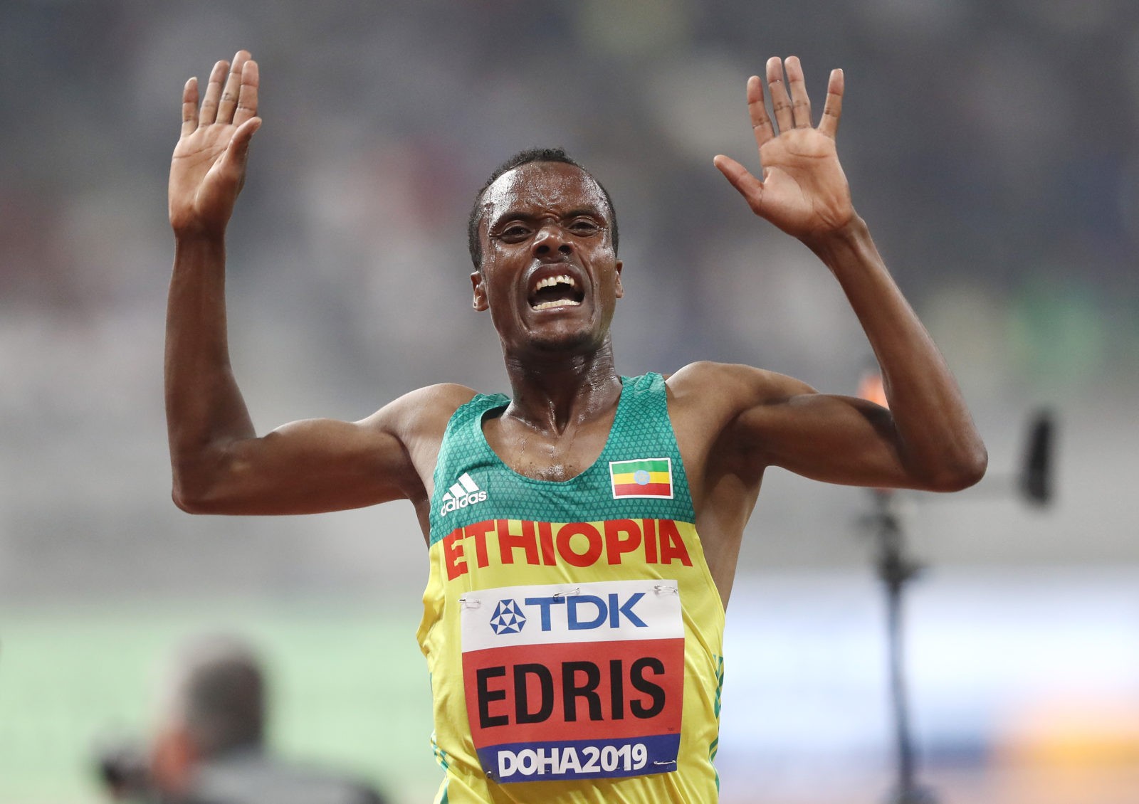 Muktar Edris of Ethiopia celebrates winning gold in the Men's 5000 metres final during day four of 17th IAAF World Athletics Championships Doha 2019 at Khalifa International Stadium on September 30, 2019 in Doha, Qatar. (Photo by Alexander Hassenstein/Getty Images for IAAF)
