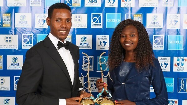 Lelisa Desisa and Ruth Chepngetich with their prizes / Photo credit: Victah Sailer / AMA