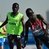 Samwel Kimani of Kenya and guide Boit James crosses the line to clinch gold in the Men's 5000m T11 final at Dubai 2019 World Para Athletics Championships. ⒸGetty Images