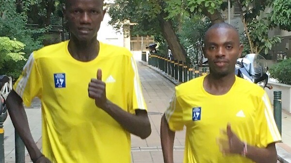 Kenyan runners Rhonzas Kilimo and Daniel Muteti (right) in Athens / Photo credit: AMA / Race News Service.