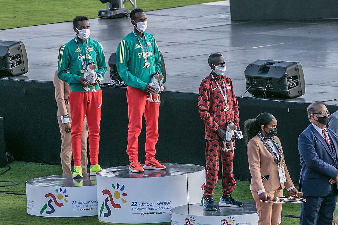 Ethiopians dominate the men's 10000m podium with Mogos Tiumay taking the gold ahead of Chimdesa Debela. Kenya's Abraham Longosiwa settles for the bronze medal / Photo credit: Yaaseen Kahaar for AthleticsAfrica.
