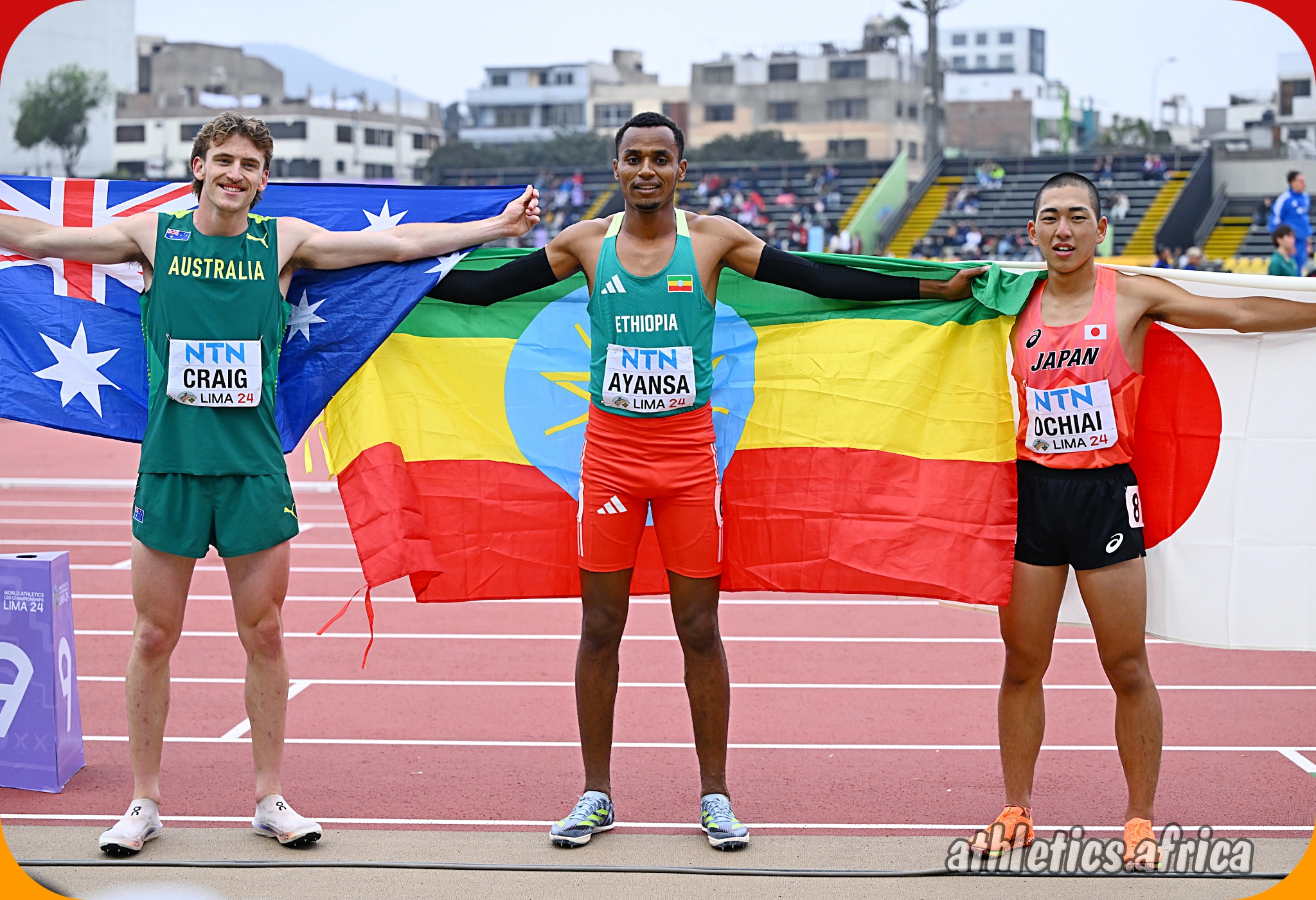 General Berhanu Ayansa of Ethiopia with the men's 800m final medallists at the World Athletics U20 Championships Estadio la Videna, Lima, Peru / Photo by Enzo Santos Barreiro for World Athletics