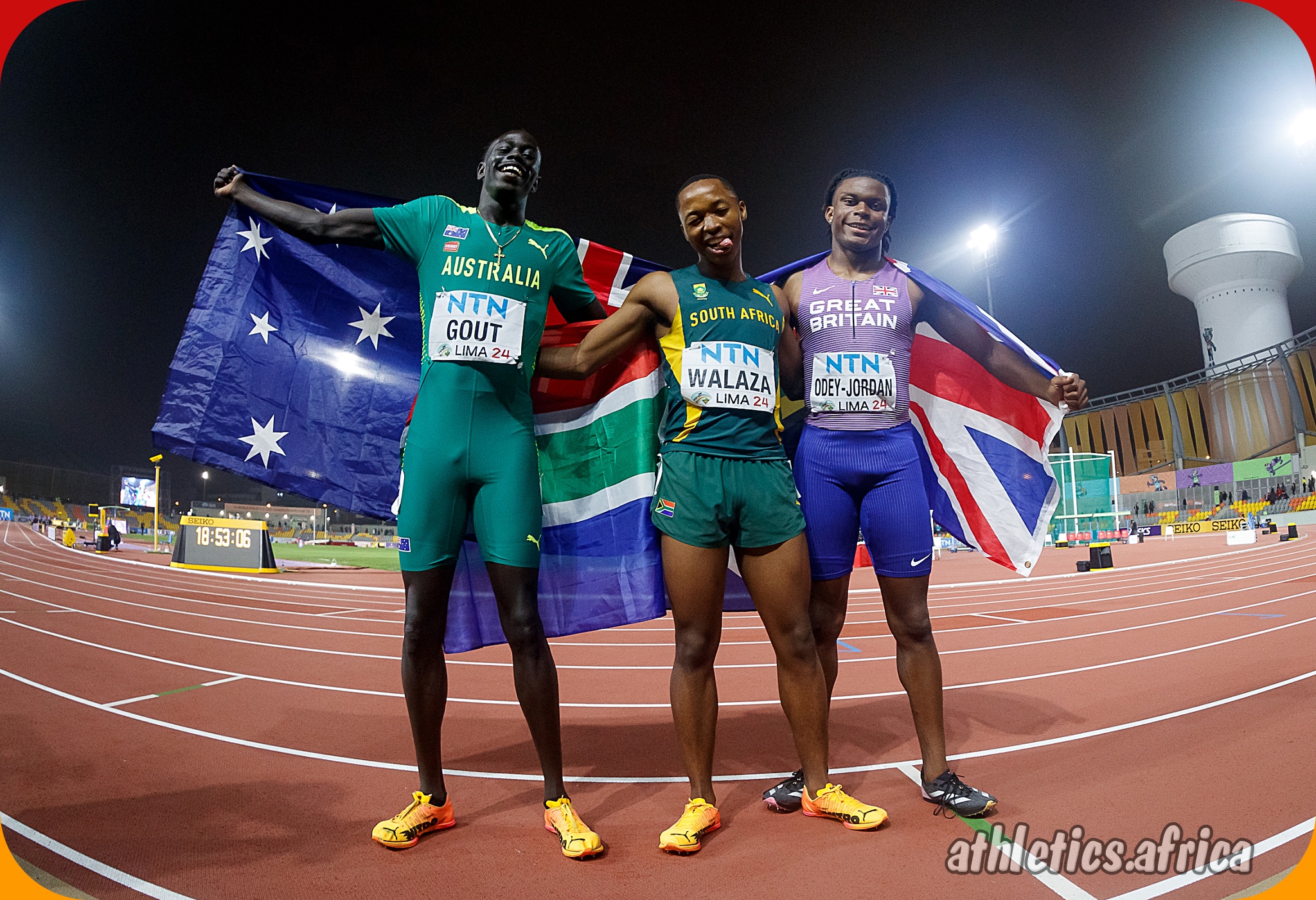Bayanda Walaza (RSA) with the men's 200m final medallists at the World Athletics U20 Championships Estadio la Videna, Lima, Peru / Photo by Oscar Muñoz Badilla for World Athletics