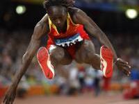Mbango retains olympic crown in Beijing